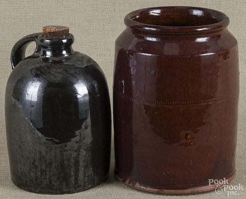 Two pieces of Pennsylvania redware, 19th c. to include a crock, 9 1/4'' h., and a jug, 9 1/8'' h.