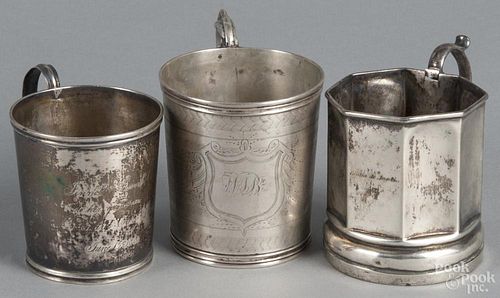 Three coin silver child's mugs, mid 19th c., one bearing the touch of C. Bard, 9.2 ozt.