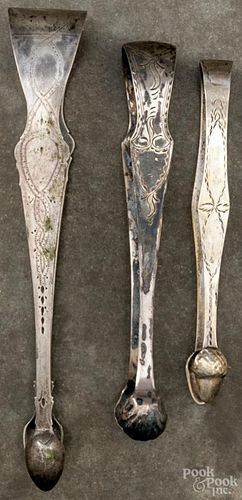 Three unmarked silver sugar tongs, 19th c., 4 ozt.