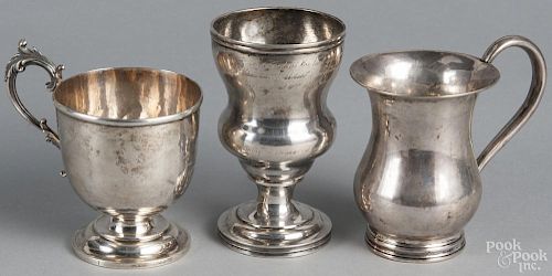 Two unmarked silver cups, 19th c., together with another marked pure coin and dated 1860, 12 ozt.