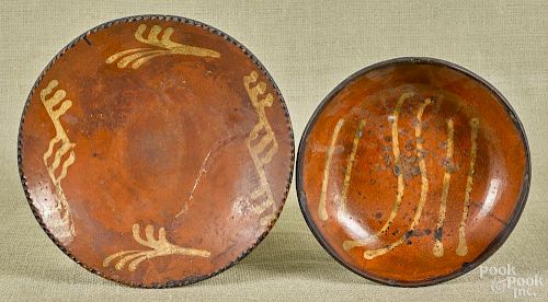 Pennsylvania redware pie plate, 19th c., with yellow slip decoration, together with a shallow bowl.