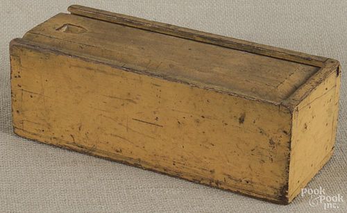 Pennsylvania painted walnut slide lid box, 19th c., retaining an old yellow surface, 3 3/4'' h.