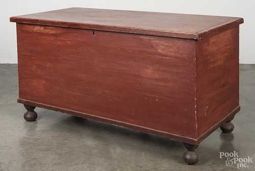 Pennsylvania painted pine blanket chest, 19th c., retaining an old red surface, 26'' h., 48'' w.