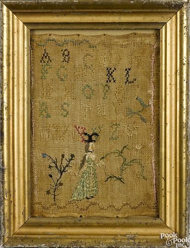 Silk on linen sampler, 19th c., depicting a young woman with a dress, 7 3/4'' x 5 1/4''.