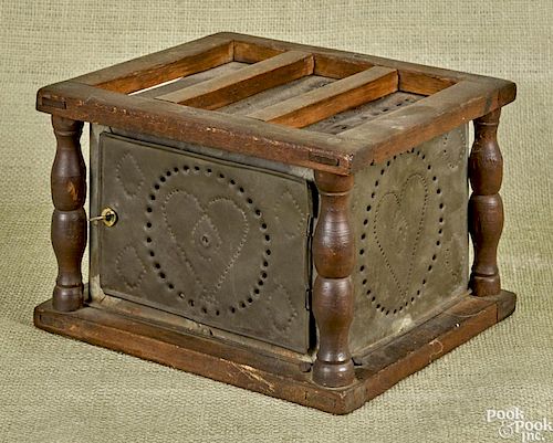 Pine and punched tin foot warmer, 19th c., 5 3/4'' h., 9'' w.