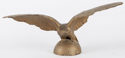 Gilt papier-mâché spread winged eagle, early 20th c., 17'' h., 34'' w.