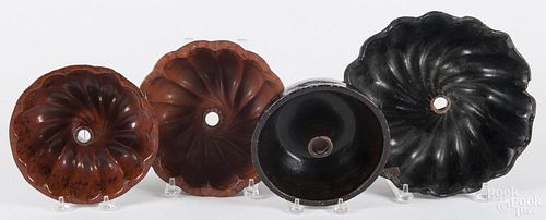Four Pennsylvania redware molds, 19th c., largest - 3'' h., 10'' w.