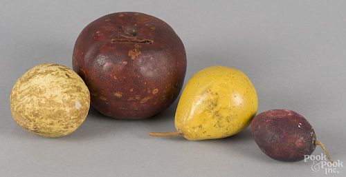 Painted redware apple bank, late 19th c., together with three pieces of composition fruit.