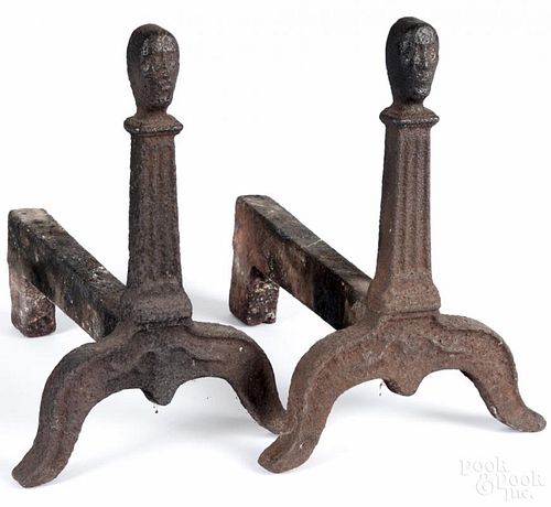 Pair of cast iron andirons, 18th/19th c., with mask finials, 11 3/4'' h.