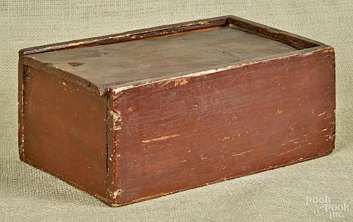 Painted pine and oak slide lid box, 19th c., retaining an old red surface, 4 1/4'' h., 10 1/4'' w.