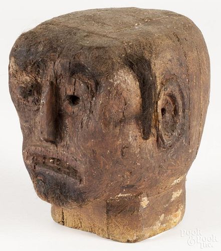 Carved wooden head, early 20th c., probably from an advertising display or carnival figure, 8 1/4'' h.