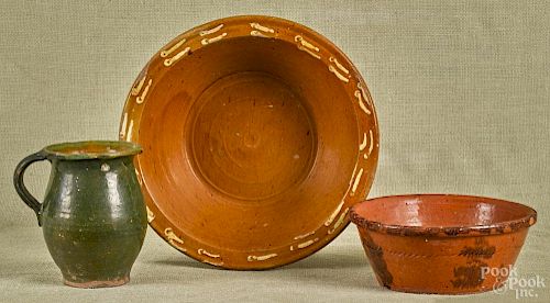 Two redware mixing bowls, 19th c., together with a green glazed pitcher, largest - 3 1/4'' h.