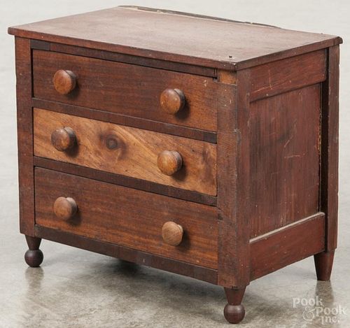 Miniature Pennsylvania pine and walnut chest of drawers, late 19th c., 8'' h., 9'' w.