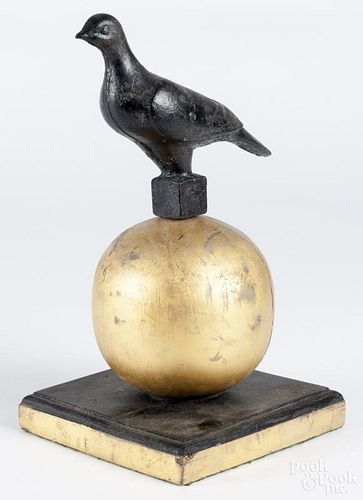 Cast iron dove finial mounted on a giltwood globe, 15 1/2'' h.