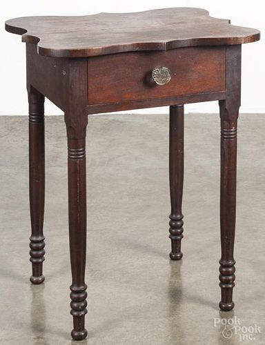 Sheraton walnut one-drawer stand, 19th c., with a scalloped top, 29 1/4'' h., 23 1/4'' w.