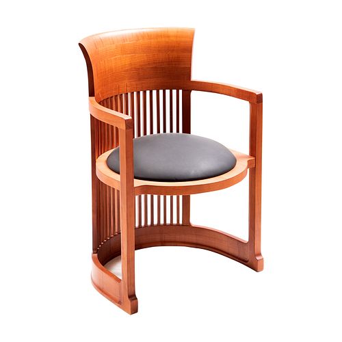 Frank Lloyd Wright. Barrel Chair. Estructura semicircular que incluye las patas y los reposabrazos. Asiento circular.