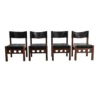 Lote de 4 sillas. México. SXX. Don S. Shoemaker. En talla de madera tropical. Con respaldos y asientos capitonados de piel color negro.
