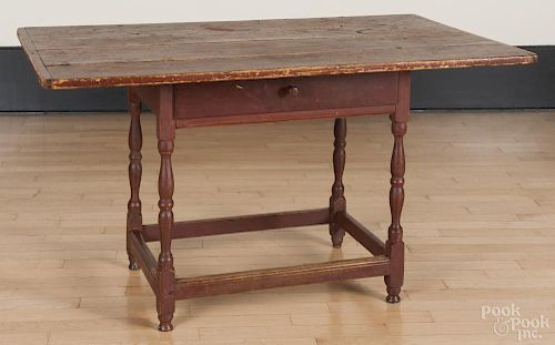 Painted pine tavern table, late 18th c., retaining an old red surface, 26'' h., 46 1/2'' w., 28'' d.