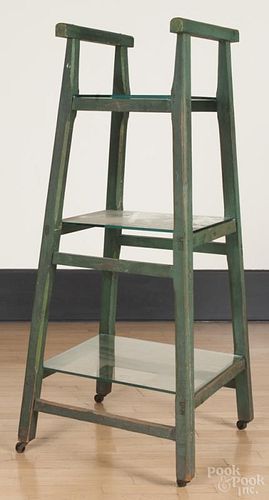 Painted pine three-tier stand, late 19th c., retaining an old green surface, 54'' h.
