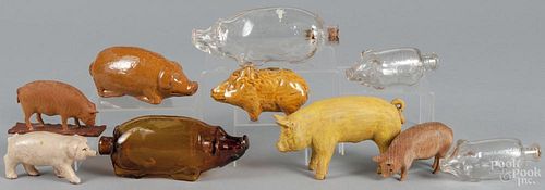 Ten assorted pig figures, together with a redware flask, 19th c., and an amber glass flask