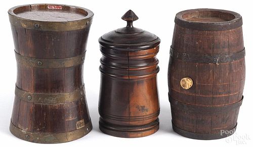 Turned lignum vitae canister, 19th c., 8 1/4'' h., together with two staved barrels, 8'' h.