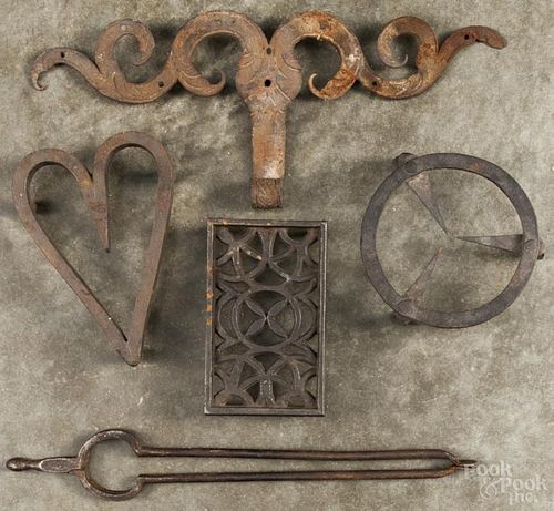 Three iron trivets, 19th/early 20th c., together with a ram's horn hinge and a pair tongs.