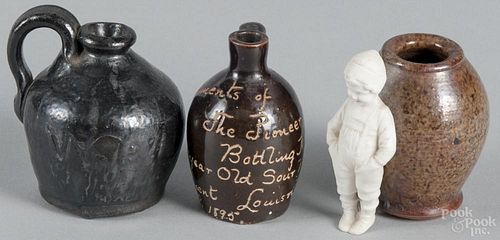 Miniature redware jug, 19th c., together with a Stahl crock with an applied bisque figure