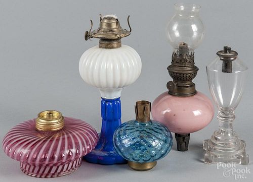 American glass lighting, 19th c., to include a clambroth and cobalt fluid lamp, a colorless lamp