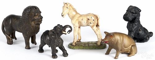 Three animal-form still banks, ca. 1900, together with a cast iron horse and elephant