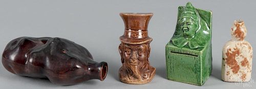 Uncle Sam pottery still bank, together with a clown bank, a potato flask, and a scent bottle
