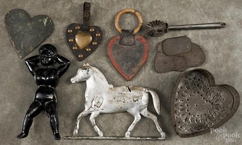 Miscellaneous items, to include a Naught Nellie bootjack, a tin jagging wheel, a heart cheese mold