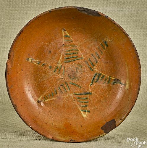 Pennsylvania redware dish, dated 1841 in the center of a green and white slip-decorated star