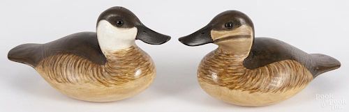 Two contemporary carved and painted duck decoys, signed Delbert Cigar Daisy, 9'' l.