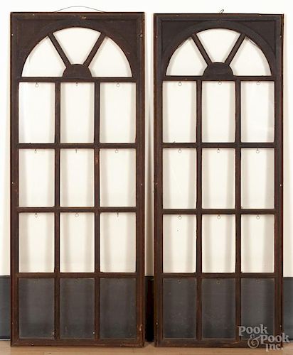 Pair of arched windows, early 20th c., with pine frames, 58'' x 22 1/4''.