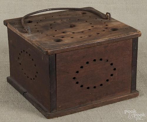 American wood foot warmer, 19th c., with punched decoration and the initials E.C., 5 3/4'' h.