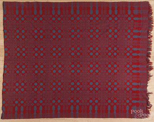 Overshot red and blue coverlet, mid 19th c., with pine tree border, 74'' x 86''.