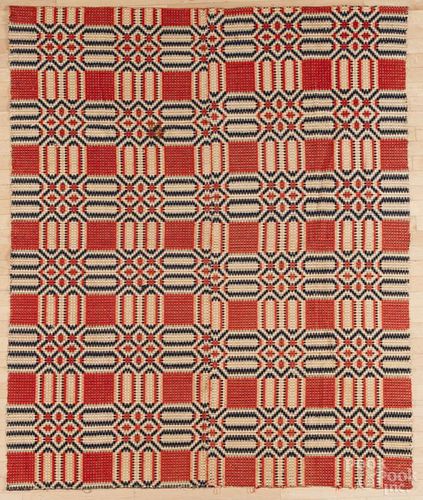 Overshot coverlet, mid 19th c., in a geometric pattern, 84'' x 67''.