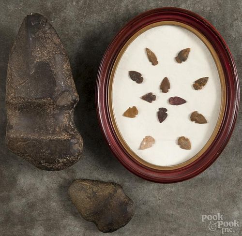 Two Native American stone axe heads, 4'' l. and 9'' l., together with a group of framed points