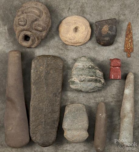 Native American and South American stone artifacts, together with a metal trade spear point.