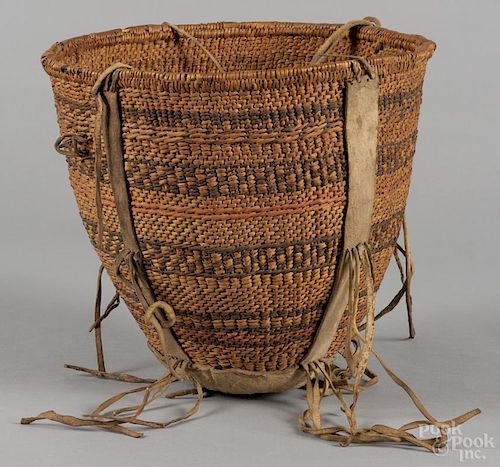 Southwest Native American hanging basket, early 20th c., with leather strapping, 11'' h., 11'' w.