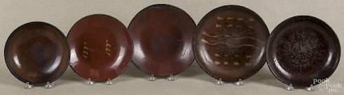 Five assorted Pennsylvania redware plates, 19th c., to include three slip decorated examples