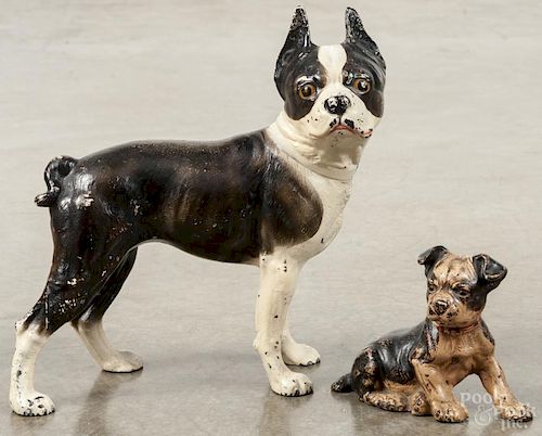 Two painted cast iron Boston terrier doorstops, 19th/20th c., one by Hubley, 10 1/2'' h. and 4 1/2'' h.