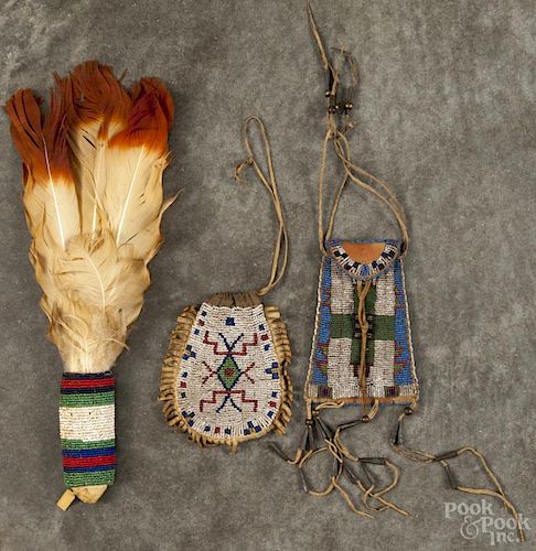 Two Plains Native American beaded hide pouches, 5'' h. and 5 1/2'' h.