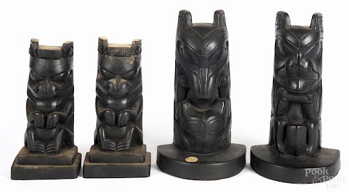 Two pairs of Northwest Coast style faux steatite totem bookends, 7 3/4'' h. and 9 3/4'' h.