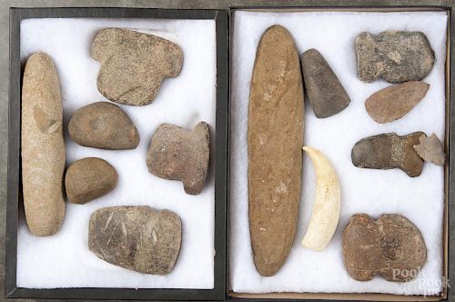 Three shadowboxes of Native American stone implements.