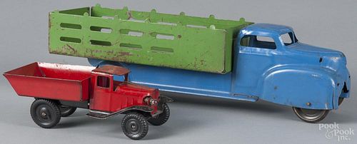 Blue and green pressed steel stake bed truck, 20'' l., together with a smaller truck with a lift bed