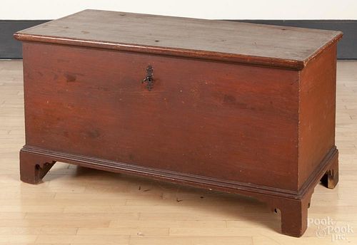 Painted hard pine blanket chest, late 18th c., retaining an old red surface, 26 1/2'' h., 49'' w.