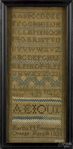 Silk on linen band sampler, dated 1835, wrought by Martha Freeman, 17 1/2'' x 7 1/2''.