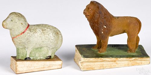 Two lion and lamp pipsqueak toys, 19th c.