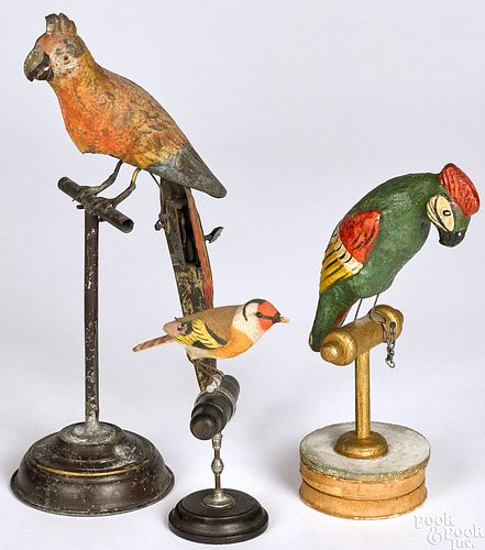 Three folk art birds on perches